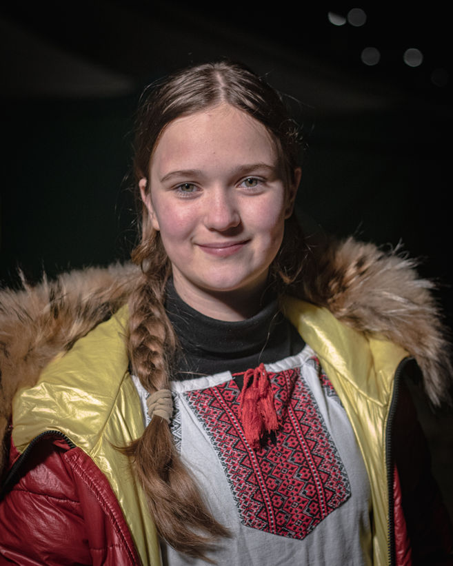 Twelve-year-old Christina wears a traditional Ukrainian outfit she carried in her luggage.