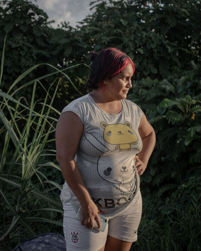 Otiene Carillos, a 26-year-old mother of three from the city of Cumaná near her home in Alvorada, one of the 14 spontaneous settlements in Boa Vista.