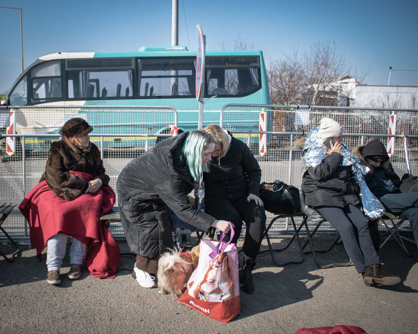 Newly arrived Ukrainian refugees wait for the next step of their journey.
