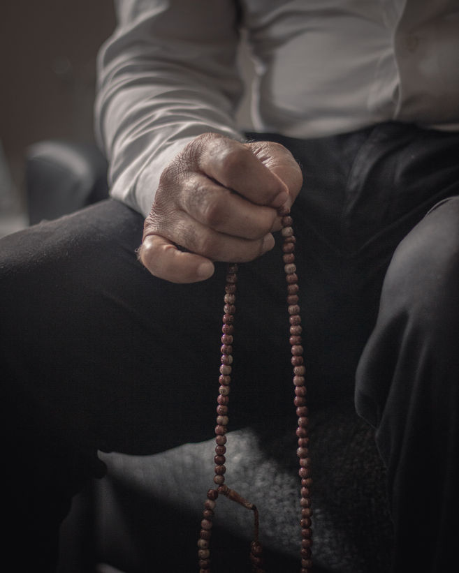 Mahmoud Alrifai holds his Misbaha (praying beads).
