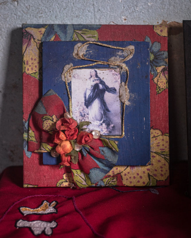 An image of the Virgin Mary is displayed on the table in Maria, known as Liquinha’s living room, in Diamantina.