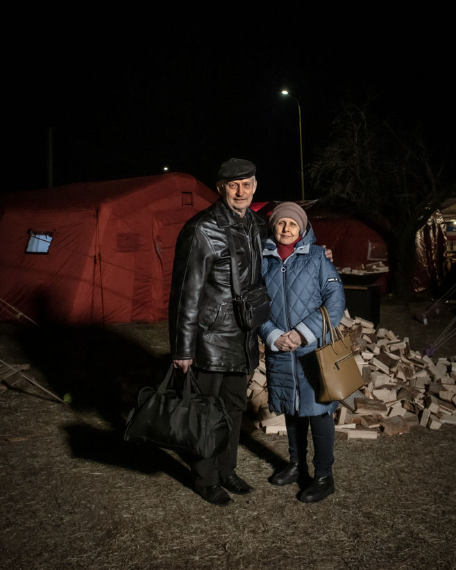 Volodymyr and Liudmyla stand in front of one of the heated sleeping shelters. They fled Ukraine through Slovak upon their daughter’s recommendation, to avoid the situation in Poland.